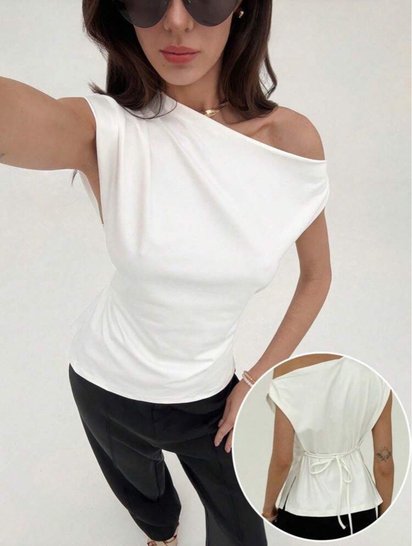 White One-Shoulder Drape Top with Tie Back (Category: Sleeveless) located in Caloocan City. Submitted by beyasclothing (Listing ID 1460687522, Image 3). Description: Fits m-l Asymmetrical Off shoulder top Color white Brand new never worn Perfect for casual date nights Pm me for more details :>>>.