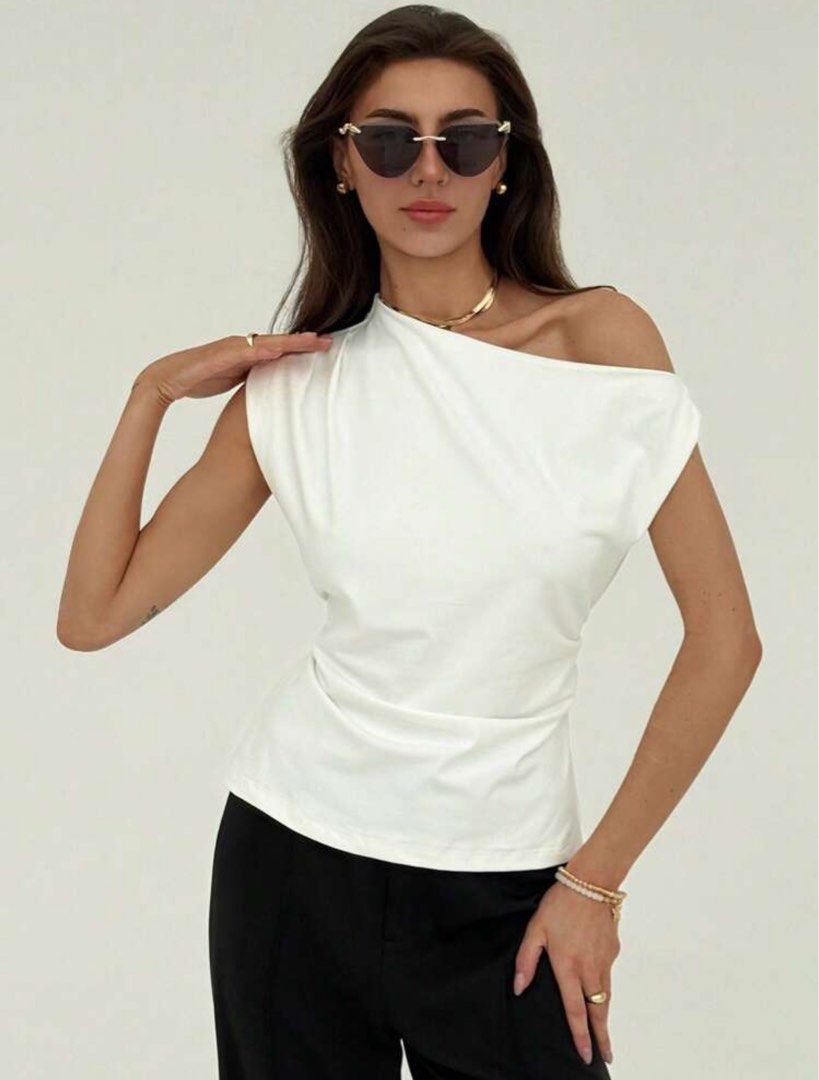 White One-Shoulder Drape Top with Tie Back (Category: Sleeveless) located in Caloocan City. Submitted by beyasclothing (Listing ID 1460687522, Image 1). Description: Fits m-l Asymmetrical Off shoulder top Color white Brand new never worn Perfect for casual date nights Pm me for more details :>>>.