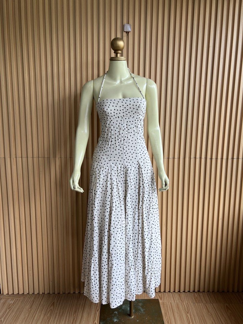 White Polka Dot Halter Neck Maxi Dress (Category: Dresses) located in Lipa City. Submitted by thyra06 (Listing ID 1460651596, Image 3). Description: - White maxi dress with classic black polka dots - Elegant halter neck design - Flowy skirt with beautiful pleats - Ideal for summer outings or casual gatherings - Combines comfort and style effortlessly - Easy to wear for any occasion.