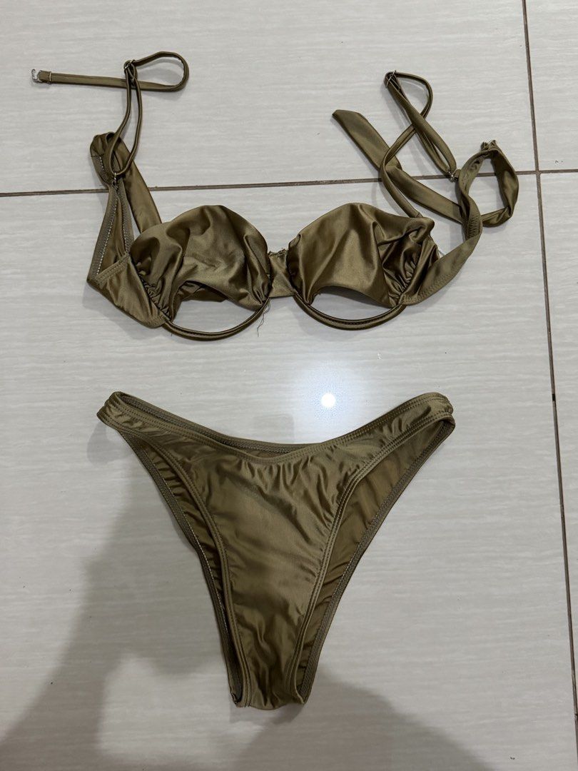Women's Bikini Set - Various Styles (Category: Bikinis & Swimsuits) located in Santa Cruz. Submitted by jhinelle (Listing ID 1460642031, Image 3). Description: - Navy blue string bikini with elegant gold rings - Black lace bikini with a comfortable nude lining - Stunning bronze/gold metallic bikini for a glamorous look - Eye-catching colorful psychedelic print bikini - All are two-piece sets, perfect for your next beach or pool adventure! .