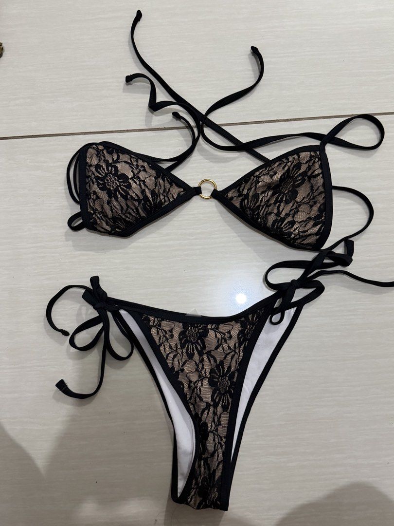 Women's Bikini Set - Various Styles (Category: Bikinis & Swimsuits) located in Santa Cruz. Submitted by jhinelle (Listing ID 1460642031, Image 2). Description: - Navy blue string bikini with elegant gold rings - Black lace bikini with a comfortable nude lining - Stunning bronze/gold metallic bikini for a glamorous look - Eye-catching colorful psychedelic print bikini - All are two-piece sets, perfect for your next beach or pool adventure! .