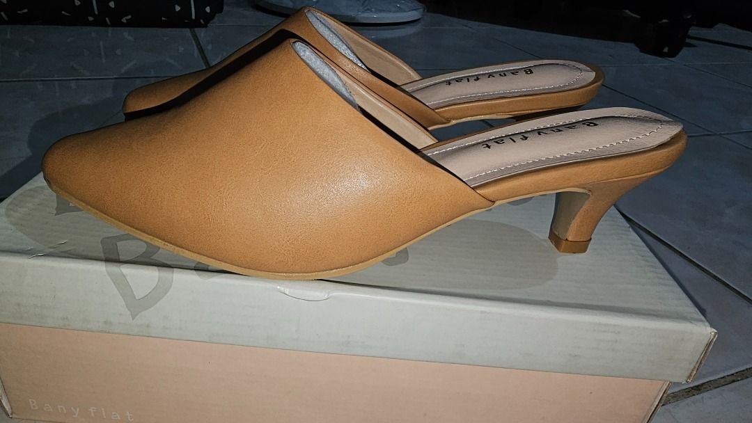 Women's Rio Mule Camel (Category: Flats & Sandals) located in Manila. Submitted by happynoonastore (Listing ID 1460632057, Image 2). Description: - Camel colored mules - Pointed toe - Kitten heel - Easy slip-on style - Versatile for dressing up or down SIZE: 250mm Original Price: 69,000 won (around php 3,000) Brand New, never been used.