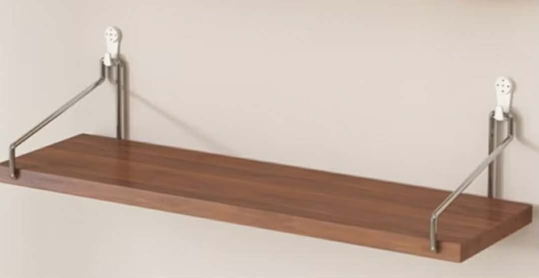 Wooden Wall Shelf with Metal Brackets (Category: Shelves, Cabinets & Racks) located in Tanza. Submitted by chickenjoyss (Listing ID 1460589927, Image 1). Description: - Sleek wooden shelf with a beautiful natural grain. - Sturdy, modern metal brackets for secure wall mounting. - Effortless installation for quick setup. - Ideal for showcasing decor, books, or small everyday items. - Enhances any room with a clean, contemporary aesthetic. 90*15 CM 
