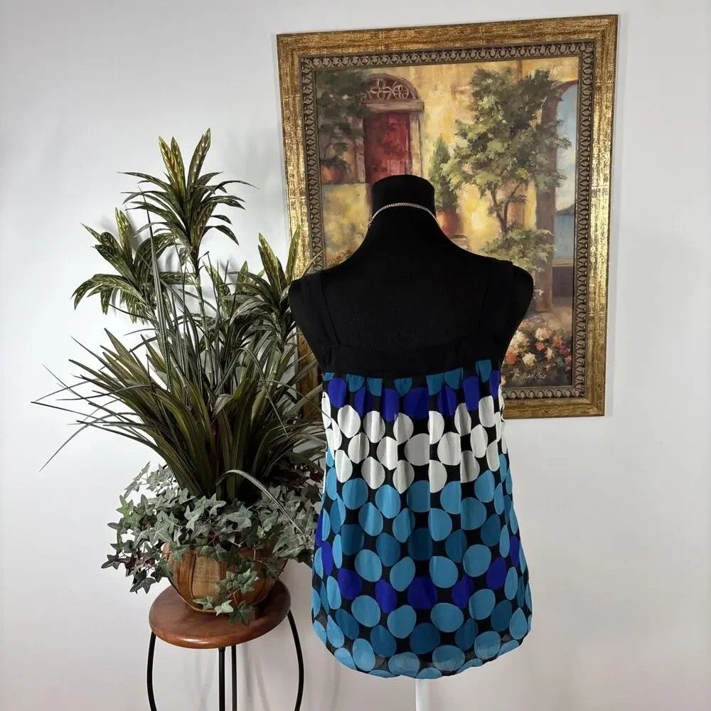 Wrapper | Y2K bubble polka dot top (Category: Sleeveless) located in Adams. Submitted by luckygirl.closet (Listing ID 1460571332, Image 3). Description: M on tag No issues Puffy princess style vibrant mix of turquoise, purple, and white polka dots with a black lace scoop neckline.