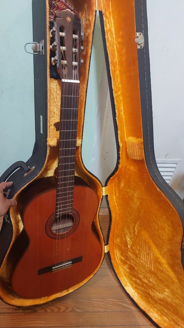 Yamaha G-120II Classical Guitar with Case (Category: Musical Instruments) located in Baliuag. Submitted by papa.gardz (Listing ID 1460673521, Image 1). Description: - Yamaha G-120II Classical Guitar - Made in Japan by Nippon Gakki Co., Ltd. - hard case included - Features beautiful wood grain - Tuners are in working condition - Perfect for practice or performance.