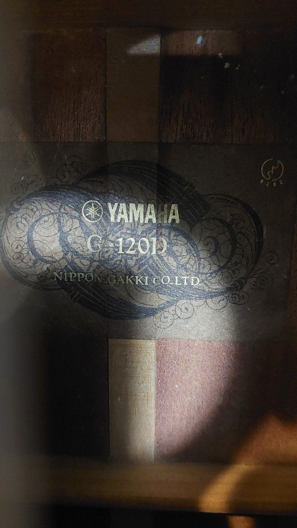 Yamaha G-120II Classical Guitar with Case (Category: Musical Instruments) located in Baliuag. Submitted by papa.gardz (Listing ID 1460673521, Image 2). Description: - Yamaha G-120II Classical Guitar - Made in Japan by Nippon Gakki Co., Ltd. - hard case included - Features beautiful wood grain - Tuners are in working condition - Perfect for practice or performance.
