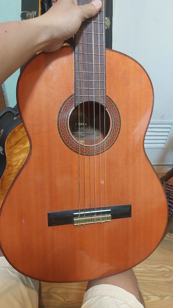Yamaha G-120II Classical Guitar with Case (Category: Musical Instruments) located in Baliuag. Submitted by papa.gardz (Listing ID 1460673521, Image 3). Description: - Yamaha G-120II Classical Guitar - Made in Japan by Nippon Gakki Co., Ltd. - hard case included - Features beautiful wood grain - Tuners are in working condition - Perfect for practice or performance.