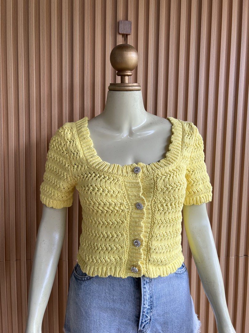 Yellow Crochet Button-Up Cropped Cardigan (Category: Coats, Jackets and Outerwear) located in Lipa City. Submitted by thyra06 (Listing ID 1460640708, Image 3). Description: - Adorable yellow crochet cardigan - Flattering square neckline - Comfortable short sleeves - Chic sparkly button details - Trendy cropped length (waist-hitting) - Versatile for pairing with shorts or jeans - Ideal for a casual, summery outfit.
