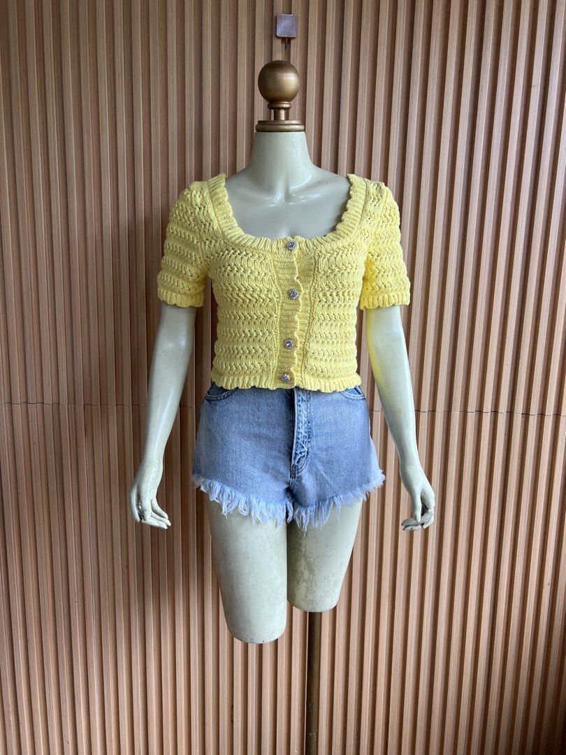 Yellow Crochet Button-Up Cropped Cardigan (Category: Coats, Jackets and Outerwear) located in Lipa City. Submitted by thyra06 (Listing ID 1460640708, Image 2). Description: - Adorable yellow crochet cardigan - Flattering square neckline - Comfortable short sleeves - Chic sparkly button details - Trendy cropped length (waist-hitting) - Versatile for pairing with shorts or jeans - Ideal for a casual, summery outfit.
