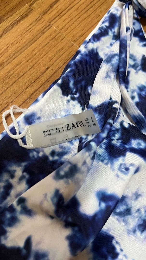 Zaful Blue Tie-Dye Strapless Bikini (Category: Bikinis & Swimsuits) located in Taguig. Submitted by fayneayana (Listing ID 1460682185, Image 2). Description: - Adorable blue and white tie-dye bikini set - Strapless bandeau top with adjustable ties - Matching bottoms with adjustable side ties - Ideal for beach days and pool parties - Get ready for summer fun!.