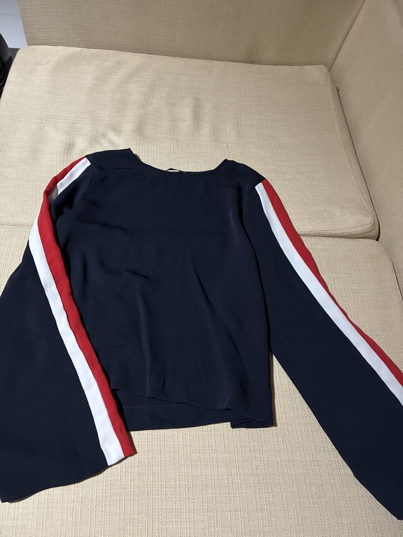 Zara Basic Navy Blue Long Sleeve Top with Red & White Stripes (Category: Blouses) located in Pasig City. Submitted by slr1949 (Listing ID 1460632219, Image 1). Description: - Zara Basic navy blue long sleeve top - Size XS (estimated) - Bell sleeves with red and white stripe detailing on arms - Versatile for casual or dressed-up looks.