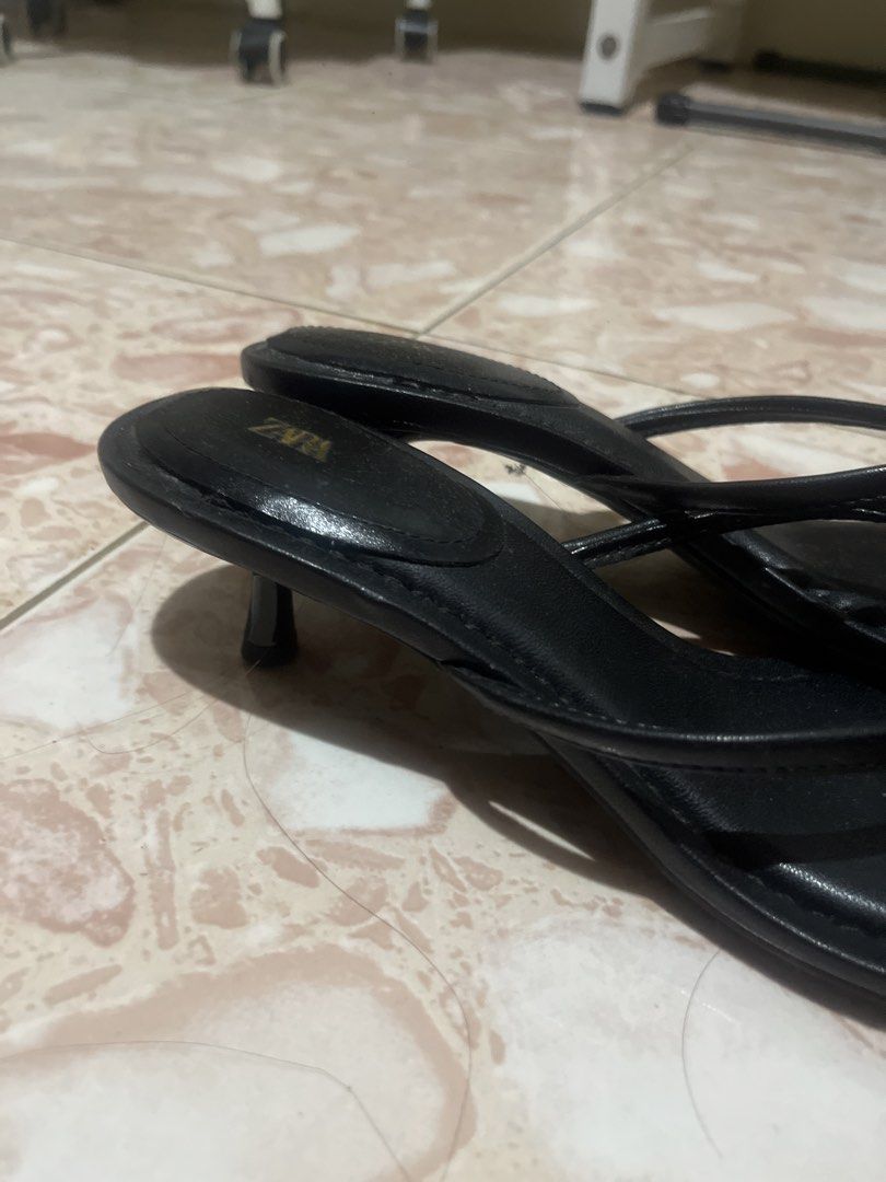 Zara Black Thong Heeled Sandals (Category: Heels) located in Baguio. Submitted by dorm608 (Listing ID 1460695515, Image 3). Description: Worn twice, then natambak na lmao so dirty pala il lclean it up tomorrow ill also post my other Zara heels BARELY WORN - Zara black heeled sandals - Open-toe thong style - Kitten heel for comfort - Comfortable for walking - Soles show minor dirt from wear - Perfect for dressing up or down.