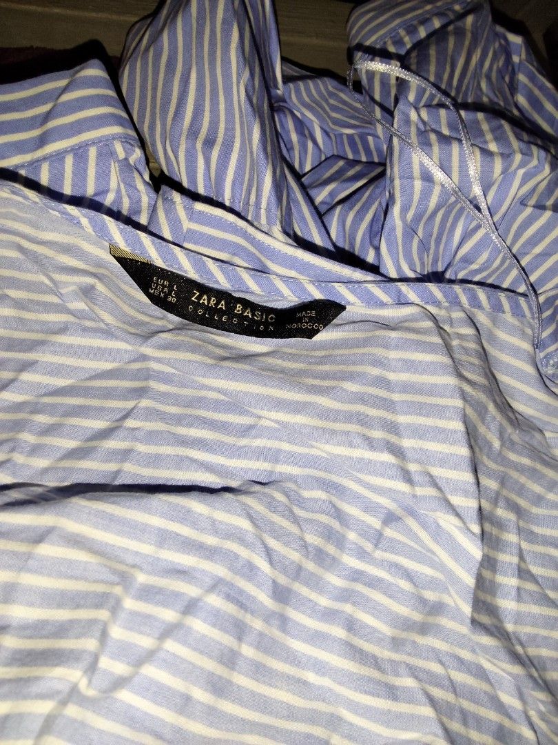 Zara Blue and White Striped Wrap Blouse (Category: Blouses) located in Manila. Submitted by chocobutternut_ (Listing ID 1460590529, Image 2). Description: - Zara blue and white striped wrap blouse - Long balloon sleeves with elastic cuffs - Tie waist closure - Lightweight fabric - Versatile for dressing up or down - can fit up to semi large.
