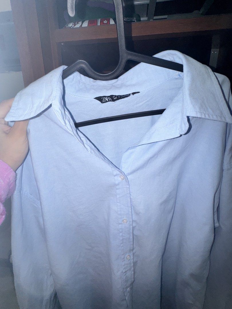 Zara Button Down Shirt (Powder Blue) (Category: Shirts) located in Los Banos. Submitted by myexcesstuff (Listing ID 1460664923, Image 2). Description: 🔆 my fave oversized shirt ! price is nego ₱₱₱ ✅ size (in tag S) but fits up to M ✅ flaws: stubborn yellow stains! not very noticeable naman, but pls see photos for ur reference ✅ rfs: not my style anymore ✅ preloved so please manage ur expectations ✅ actual color is reflected on the photos with fl