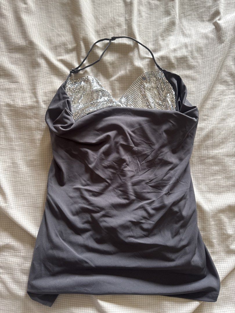 ZARA Grey Halter Top with Sparkly Embellished Bust (Category: Sleeveless) located in Manila. Submitted by chicclosetco (Listing ID 1460545908, Image 1). Description: - Grey halter neck top - Features sparkly silver embellishments on the bust - Adjustable straps for a perfect fit - Ideal for night outs and parties - Versatile piece: looks great with jeans or a skirt.