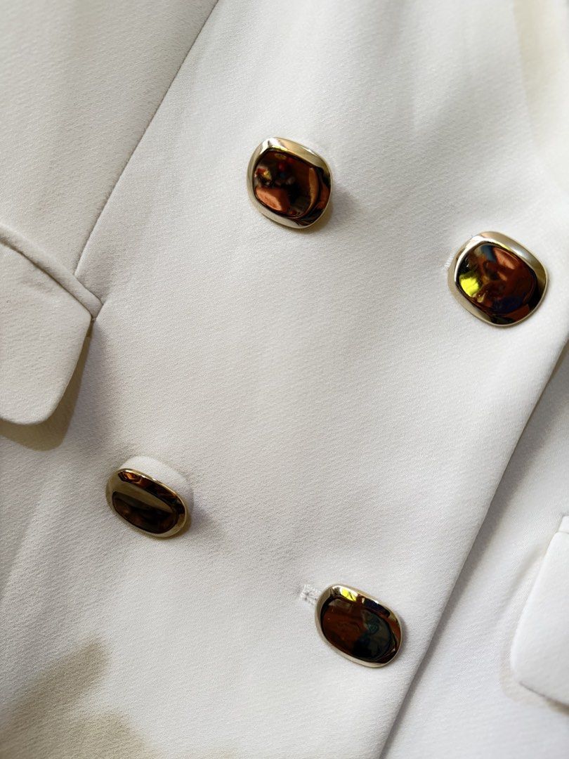 Zara white Blazer Coat dress (Category: Coats, Jackets and Outerwear) located in Quezon City. Submitted by cattodoggo (Listing ID 1460593215, Image 3). Description: Used once. No flaws. Rare find. Lined. Has gold buttons. Color is white. Padded shoulders. Medium on tag but runs small. Can fit up to semi medium. DM for actual when worn..